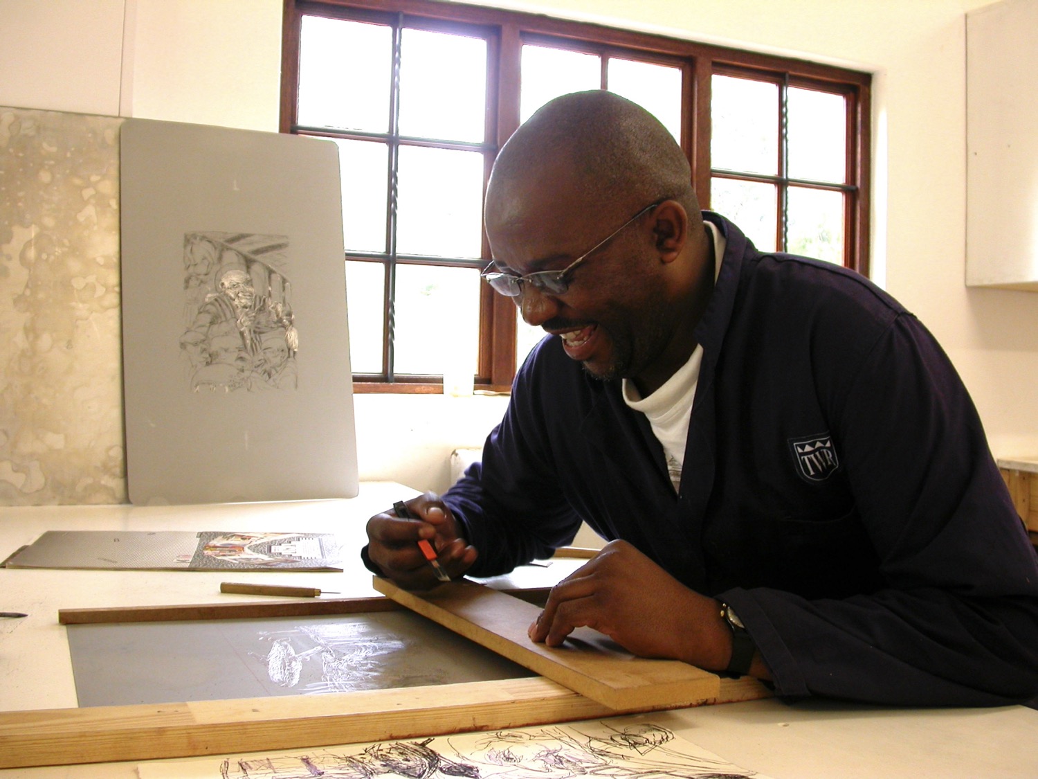 Scratch lithography and hand coloured prints that investigate contemporary urban life in South Africa.