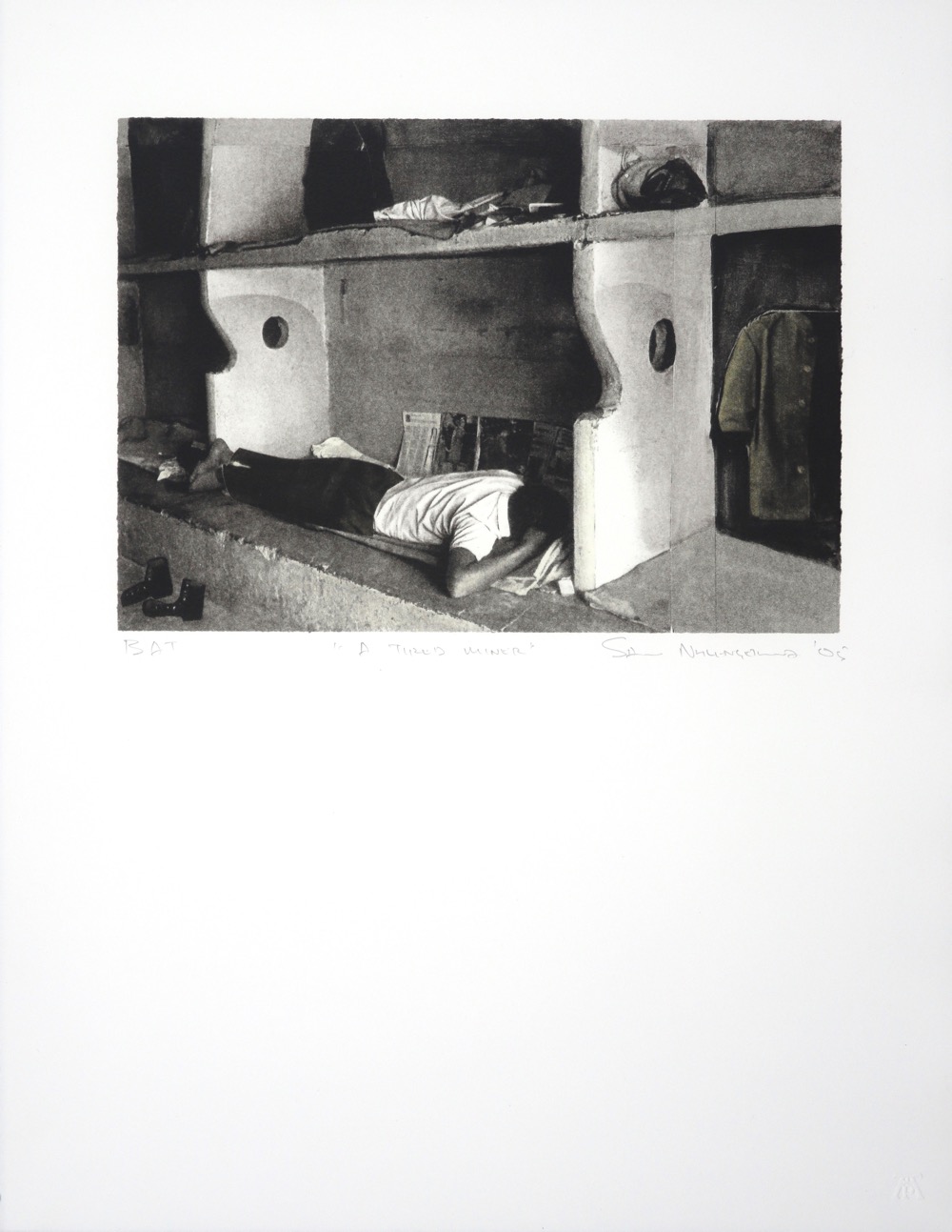 A man sleeping on a concrete bunk bed in a South African mine hostel