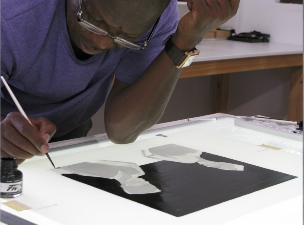 Sam Nhlengethwa painting the film for a colour separation for one of his conversation lithographs.
