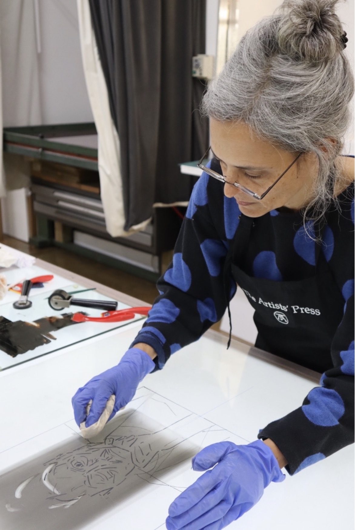Lithographs by Joni Brenner whose artistic process almost exclusively focuses on a human skull.