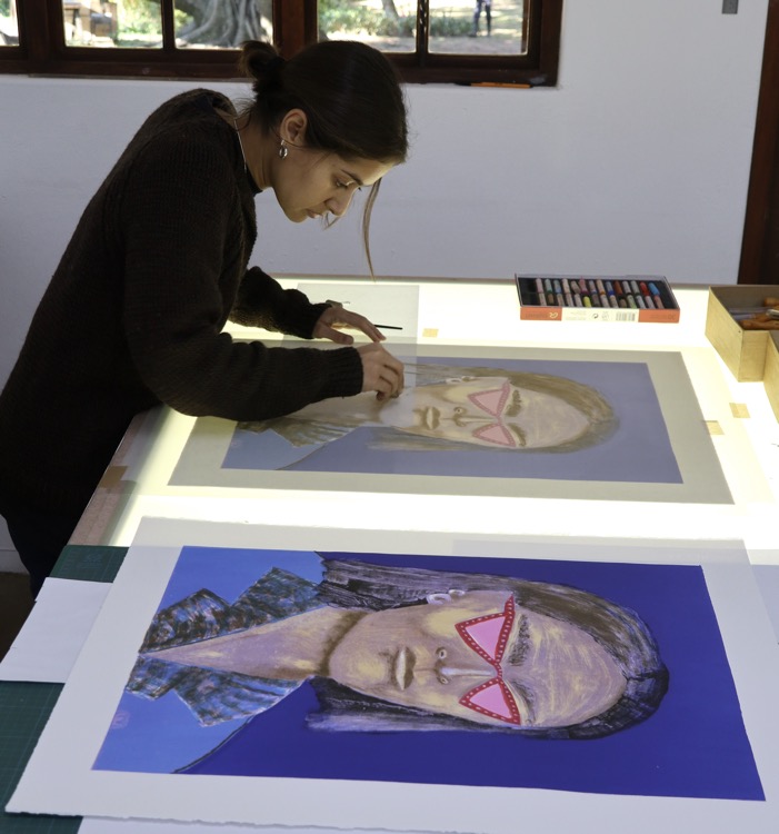 Nabeeha Mohamed working on a lithograph at The Artists' Press