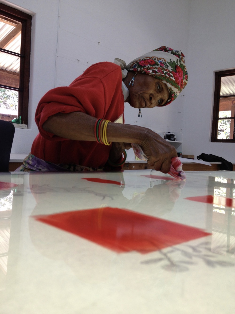 Monoprints by Xaga Tcuixgao that reflect her view on the world from her home in D'kar, Botswana; where she is a member of the Kuru Art Project.